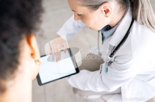 Image of Woman doctor, medical results and tablet screen at hospital with patient and mockup space. Wellness advice, technology and mature female professional with healthcare, consulting and internet search