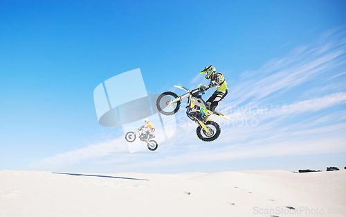 Image of Motorbike, people and sports with exercise, challenge and performance with safety, desert and workout. Athletes, sand or bikers with competition, practice or cycling with exercise, training or energy