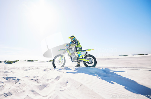 Image of Desert, motorbike and man outdoor for sport, adventure and travel on mockup space. Offroad, sand and driver on motorcycle on dirt track in nature for action, competition race and thinking of freedom