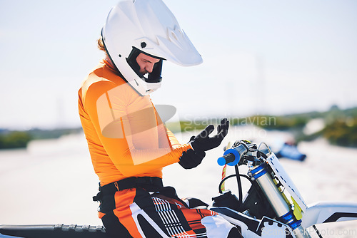 Image of Motorbike, safety gear and ready for race in desert, training and practice for challenge on sand dunes. Athlete, outdoor and adrenaline in extreme sports, fitness and competition on dirt bike