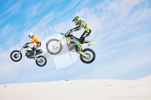 Image of Jump, people and motorbike with exercise, competition and challenge with safety, fitness and performance. Athletes, sand and bikers with mockup, practice and cycling with freedom, workout and energy