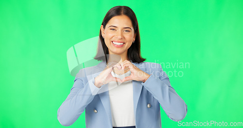 Image of Portrait, heart hands and woman with green screen, business and kindness on a studio background. Face, happy person and model with promotion, symbol for love and feedback with employee and review