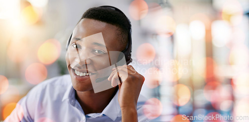 Image of Call center, portrait and man in office with bokeh for crm telemarketing consultation with headset. Mockup space, contact and professional African male technical customer support agent in workplace.