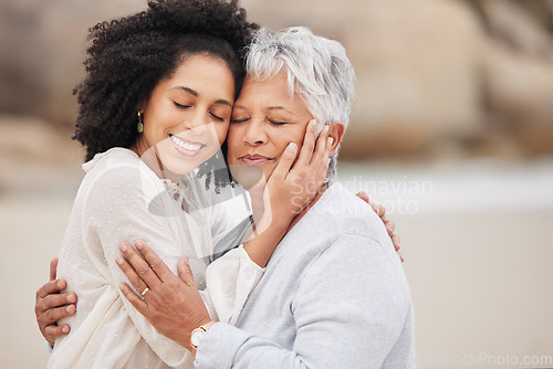 Image of Women, mother and daughter on beach, hugging and smiling in embrace, love and happiness. Family vacation, joy and bonding for retirement, resting and relaxation on ocean, enjoying and quality time