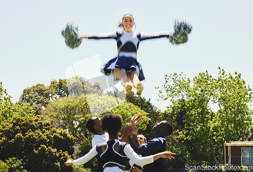 Image of Cheerleader, jump stunt and sports performance on field with teamwork, trust and collaboration. Team, training and prepare for support competition with gymnastics, energy and skill with excellence