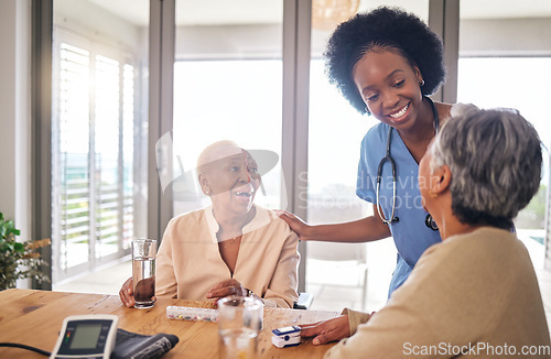 Image of Doctor with senior women at table in nursing home for consultation, check up and conversation. Nurse, caregiver or medical professional with elderly patient in living room for advice, chat and care