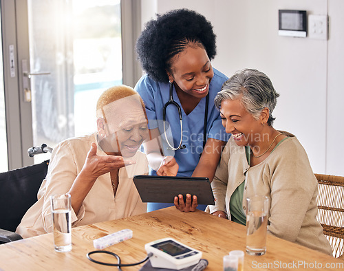 Image of Tablet, smile and an assisted living nurse with old women in the kitchen of a retirement home for consulting. Technology, medical and an african caregiver showing information to patient friends