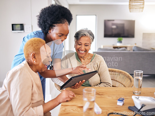 Image of Tablet, smile and an assisted living nurse with old people in the kitchen of a retirement home for consulting. Technology, medical and an african caregiver showing information to woman friends