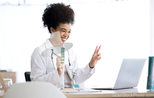 Image of Woman, doctor and laptop with video call at clinic for advice, product or peace sign for healthcare in office. Medic, nurse or pharmacist with box, drugs or emoji for telehealth consultation on pc