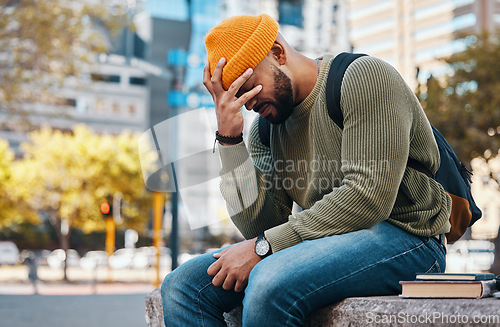 Image of Stress, headache and student outdoor in college, campus or city with anxiety, crisis or problem in education. Frustrated, man and depression in university from studying, education or fatigue