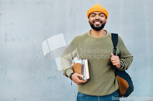 Image of Student, portrait and backpack with books for scholarship, university or college education and learning on wall background. Happy face of african man with his bag, notebook and studying or research