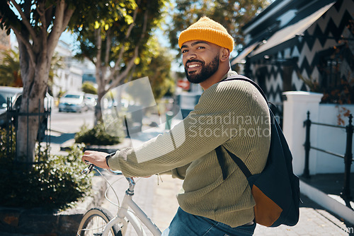Image of Bicycle, travel and portrait of man in city for commute, adventure and journey for weekend, holiday or vacation. Fashion, style and person on bike for eco friendly transport, exercise and cycling