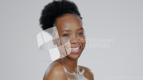 Image of Face, skincare and smile of black woman in studio isolated on a gray background mockup space. Portrait, natural beauty and cosmetics of African model in spa facial treatment, wellness and skin health