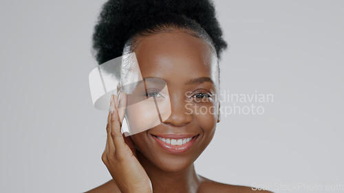 Image of Face, skincare and hands of happy black woman in studio isolated on gray background mockup space. Portrait, natural cosmetics and African model touch skin in spa facial treatment, wellness or health