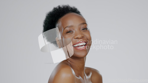 Image of Face, skincare and beauty of funny black woman in studio isolated on a gray background mockup space. Portrait, natural cosmetics and African model laugh in spa facial treatment, wellness and health