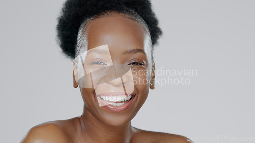 Image of Face, skincare and beauty of excited black woman in studio isolated on a gray background mockup space. Portrait, natural cosmetics and African model in spa facial treatment, wellness and skin health