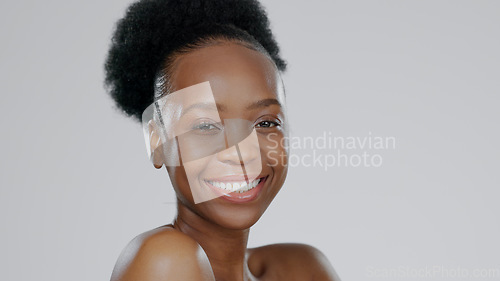 Image of Face, skincare and beauty of happy black woman in studio isolated on a gray background mockup space. Portrait, natural cosmetics and African model in spa facial treatment, wellness and skin health