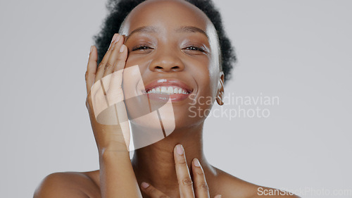 Image of Touch face, skincare and beauty of black woman in studio isolated on gray background for dermatology. Portrait, hands and happy model in spa facial treatment, wellness or natural cosmetics for health