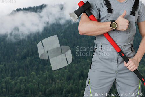 Image of Lumberjack in the woods with an ax