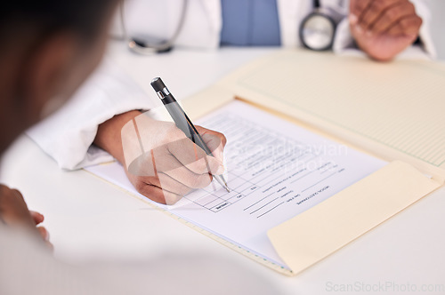 Image of Doctor, patient and hands writing on documents for prescription, diagnosis or results on table at hospital. Closeup of medical worker filling healthcare paperwork, life insurance or policy at clinic