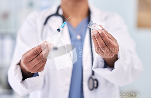 Image of Hands, doctor with needle and vaccine bottle for healthcare, safety from virus and medicine in hospital. Pharmaceutical drugs, person has container and syringe for immunity with health and wellness