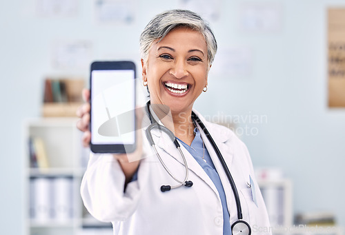 Image of Phone screen, senior woman and doctor with advertising mockup and portrait, app and ads with telehealth. Social media promo, smartphone and healthcare information on website with smile at clinic