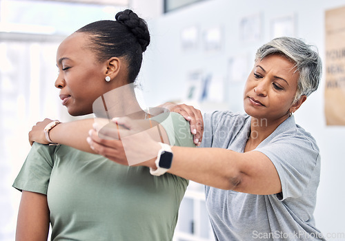 Image of Shoulder pain, physical therapy and chiropractor with patient, injury and healthcare with help and women at clinic. Physiotherapy, stretching muscle and anatomy with body, support and trust in health