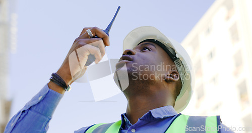 Image of Communication, radio and construction worker, man or manager for project management in urban city. African builder in engineering inspection, building progress or architecture survey on walkie talkie