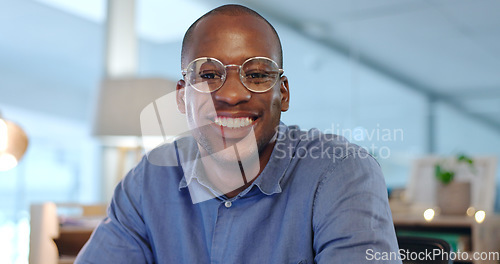 Image of Manager, portrait and black man with smile at desk in office for with pride, confidence and success in entrepreneurship. Businessman, face and happiness for professional or corporate career in Kenya