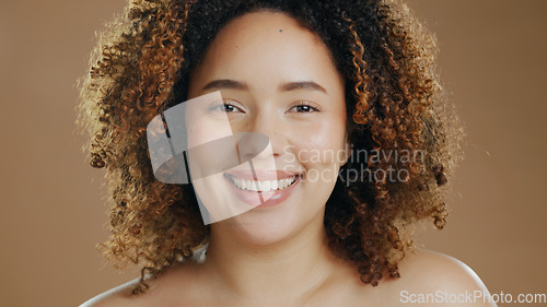 Image of Portrait of happy woman, natural skincare dermatology or cosmetic wellness in studio with smile. Skin glow, model or confident biracial female person with beauty results or pride on brown background