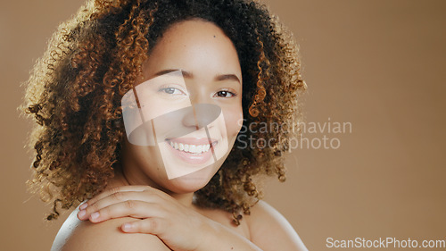 Image of Portrait of happy woman, skincare or natural beauty for wellness in studio with smile or skin glow. Face, pride or confident biracial female person with dermatology mockup space on brown background