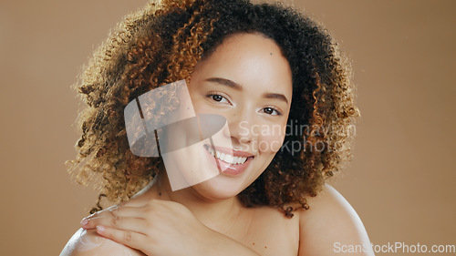 Image of Portrait of happy woman, natural beauty or healthy skin for wellness in studio with smile or glow. Dermatology, cosmetics or confident biracial girl model with skincare results on brown background