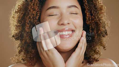 Image of Face of happy woman, natural or healthy skin for wellness in studio with smile, facial results or glow. Dermatology, relax or confident biracial girl model with skincare cosmetics on brown background