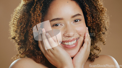 Image of Portrait of happy woman, smile or healthy skin for wellness in studio with beauty, facial results or glow. Dermatology, natural or confident biracial model with skincare cosmetics on brown background