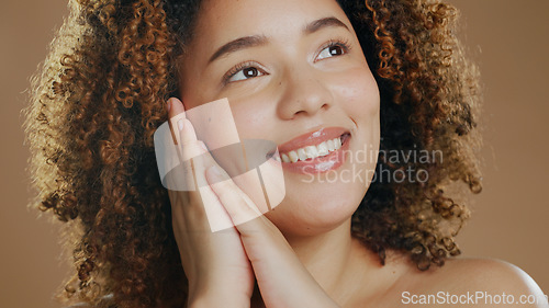 Image of Thinking, happy woman or natural beauty dermatology for cosmetics or wellness in studio with smile. Skin glow, relax or confident biracial female person with skincare results on a brown background