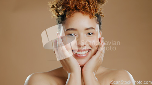 Image of Woman in portrait, skincare and beauty, happy with natural cosmetics and glow on brown background. Dermatology, wellness for skin and hands touching face with self care and anti aging in studio