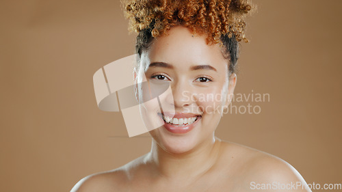 Image of Woman in portrait, natural beauty and happy with cosmetics and skin glow isolated on brown background. Dermatology, wellness with skincare and face with smile, self care and anti aging in studio