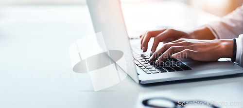 Image of Hands, laptop and a business woman typing on space in the office while working on a report or research. Computer, mockup and flare with a professional employee closeup at a desk in the workplace