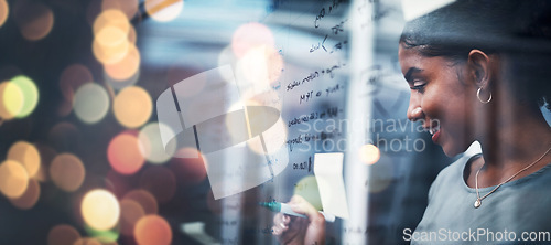 Image of Happy woman, writing and schedule planning at night on glass board for strategy or ideas at office on bokeh background. Female person smile working late on project plan, tasks or agenda at workplace