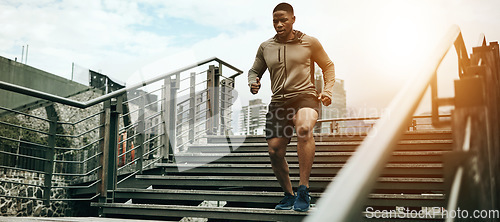 Image of Fitness, city and black man running on steps outdoor, exercise and training healthy body in the morning. Sports, cardio and African athlete on stairs for endurance workout, energy or jog for wellness