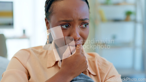 Image of Crying, fear and black woman on couch with a problem, crisis and frustrated in a home living room or lounge. Fear, house and person scared and anxious about a mistake, fail or unhappy on a sofa