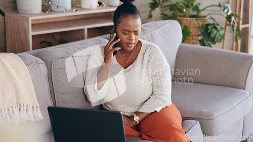 Image of Laptop, phone call and worry with a black woman on a sofa in the living room of her home for problem solving. Computer, communication and a concerned person talking on her mobile for networking