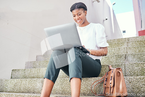 Image of Woman, laptop and typing remote work on stairs with thinking, smile and ideas for content creation. African copywriting expert, computer and happy for vision, planning and solution for project