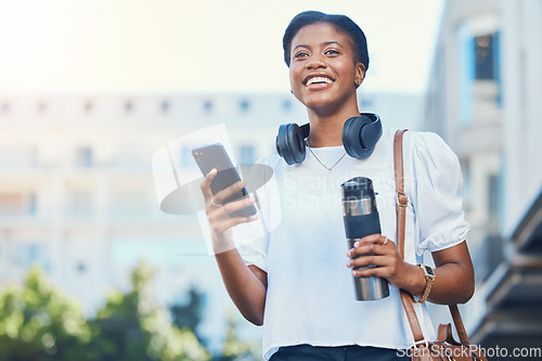 Image of Cellphone, coffee and young woman in the city networking on social media, mobile app or the internet. Happy, flask and African female person scroll on website with phone walking in urban town street.
