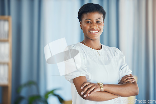 Image of Lawyer, portrait and black woman in office with arms crossed in confidence for justice, law firm and legal career. Attorney, smile or face of employee with pride in workplace or human rights advocate