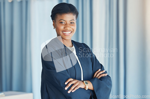 Image of Lawyer, portrait and black woman in office with arms crossed in confidence for justice, law firm and legal career. Judge, smile or face of attorney with pride in court or human rights advocate