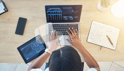 Image of Person, hands and laptop, stock market and trading with tablet, notebook and typing top view of workspace. Cryptocurrency, research and investment with dashboard, stats and graph on screen for trader