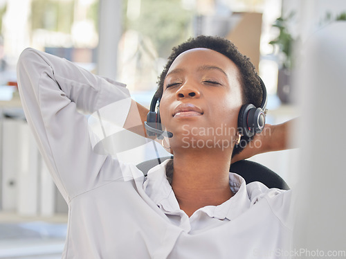 Image of Black woman, call center and relax by consultant in office on break, nap or rest while working in customer service. Customer support, girl and resting agent between crm, telemarketing and faq