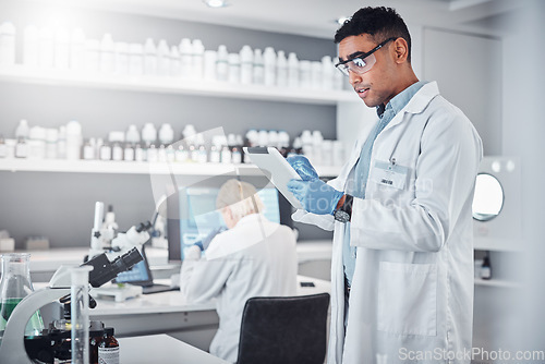 Image of Scientist, tablet and research innovation in laboratory for medical analytics, science development or biotech neuroscience. Pharmaceutical data, doctor and pharmacy engineer working in clinic lab