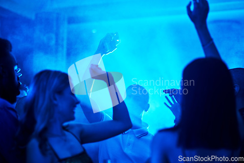 Image of People dancing in a nightclub, crowd at a party listening to disco or social celebration of new years eve in Las Vegas. Music festival event, celebrate a night out together or techno lighting at rave